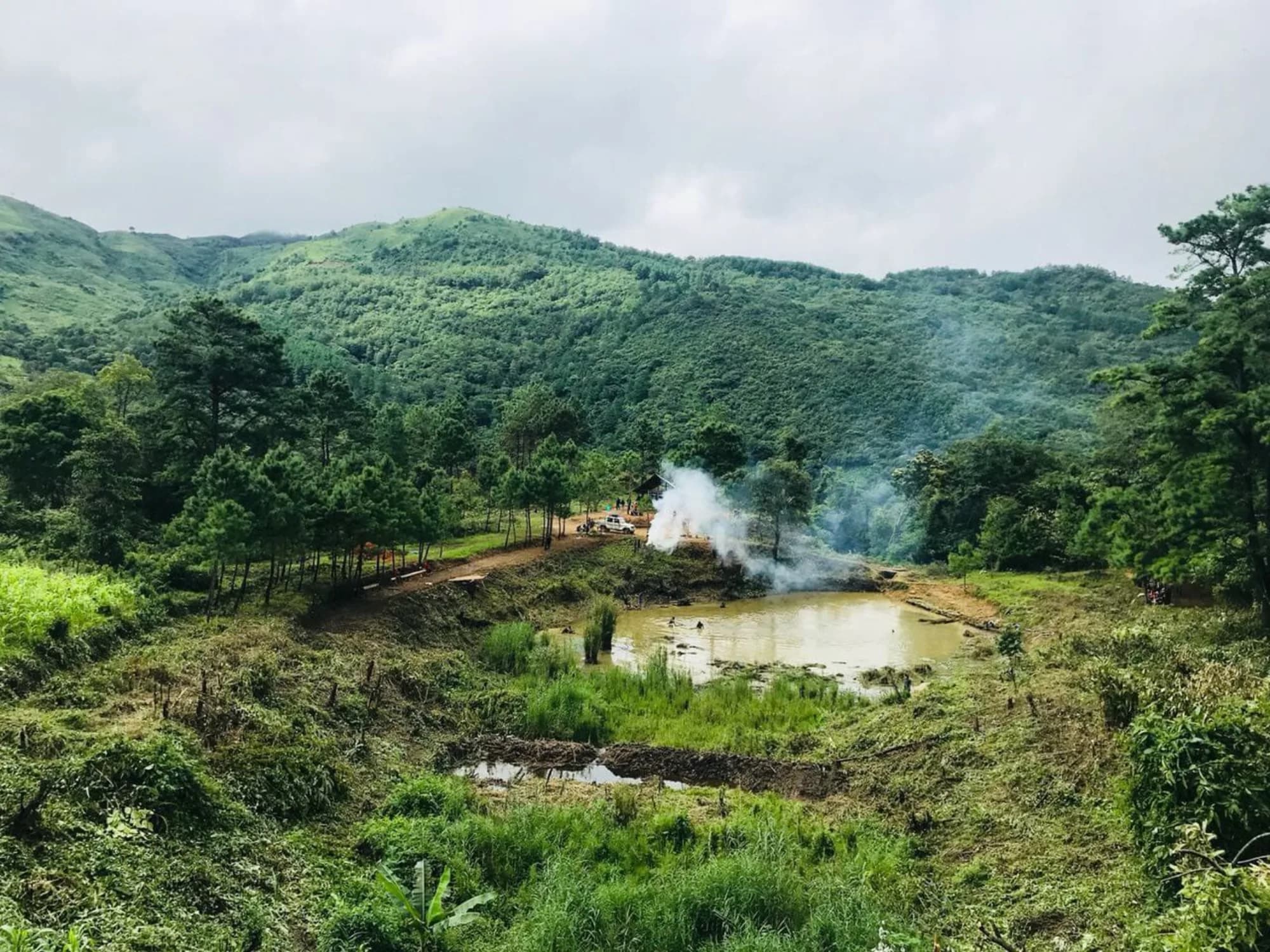 Pond and wooded ground of the kind the Thoubal farmhouse sits in
