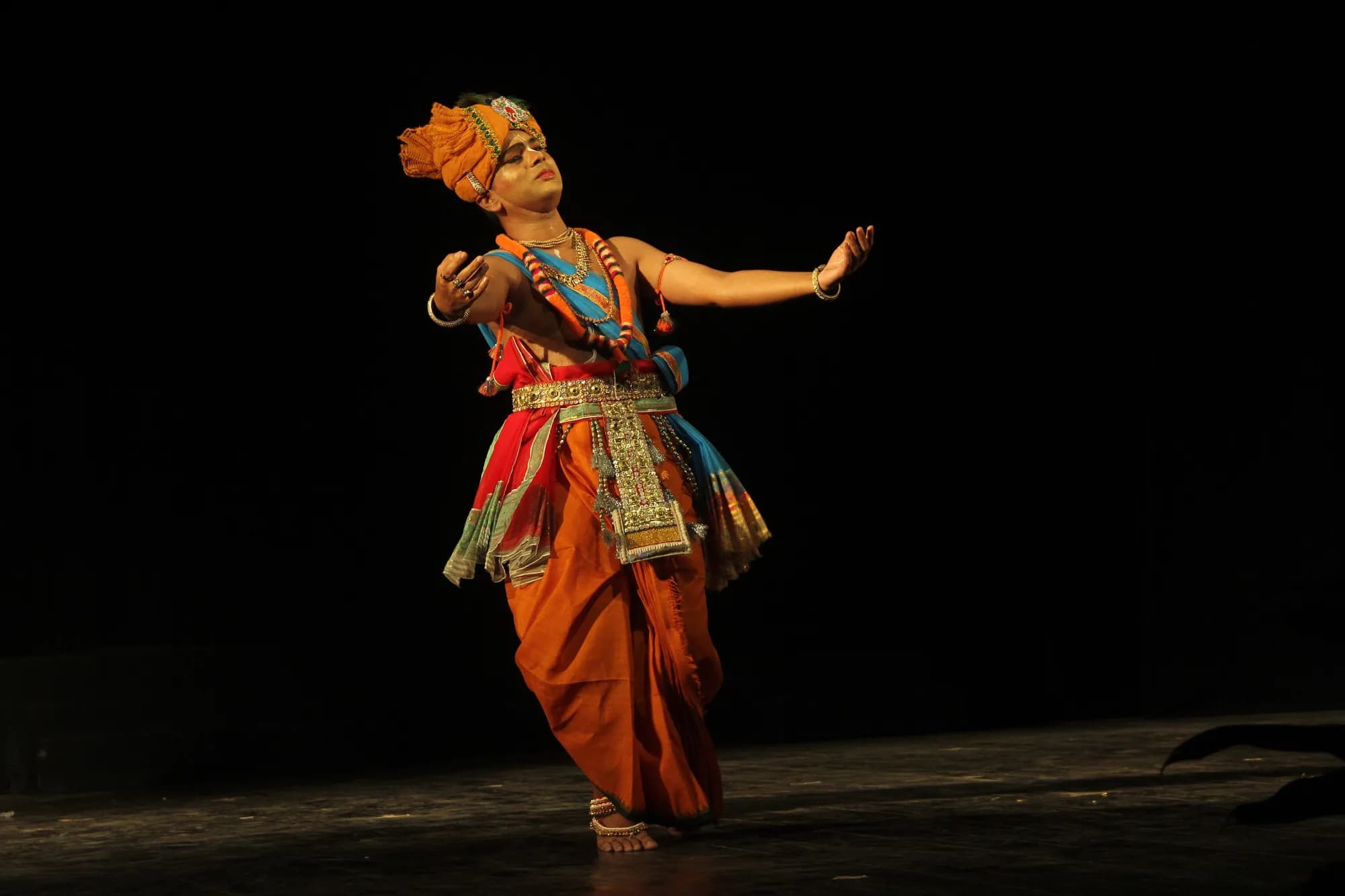 A Manipuri dancer mid-step, the form danced through Yaoshang nights