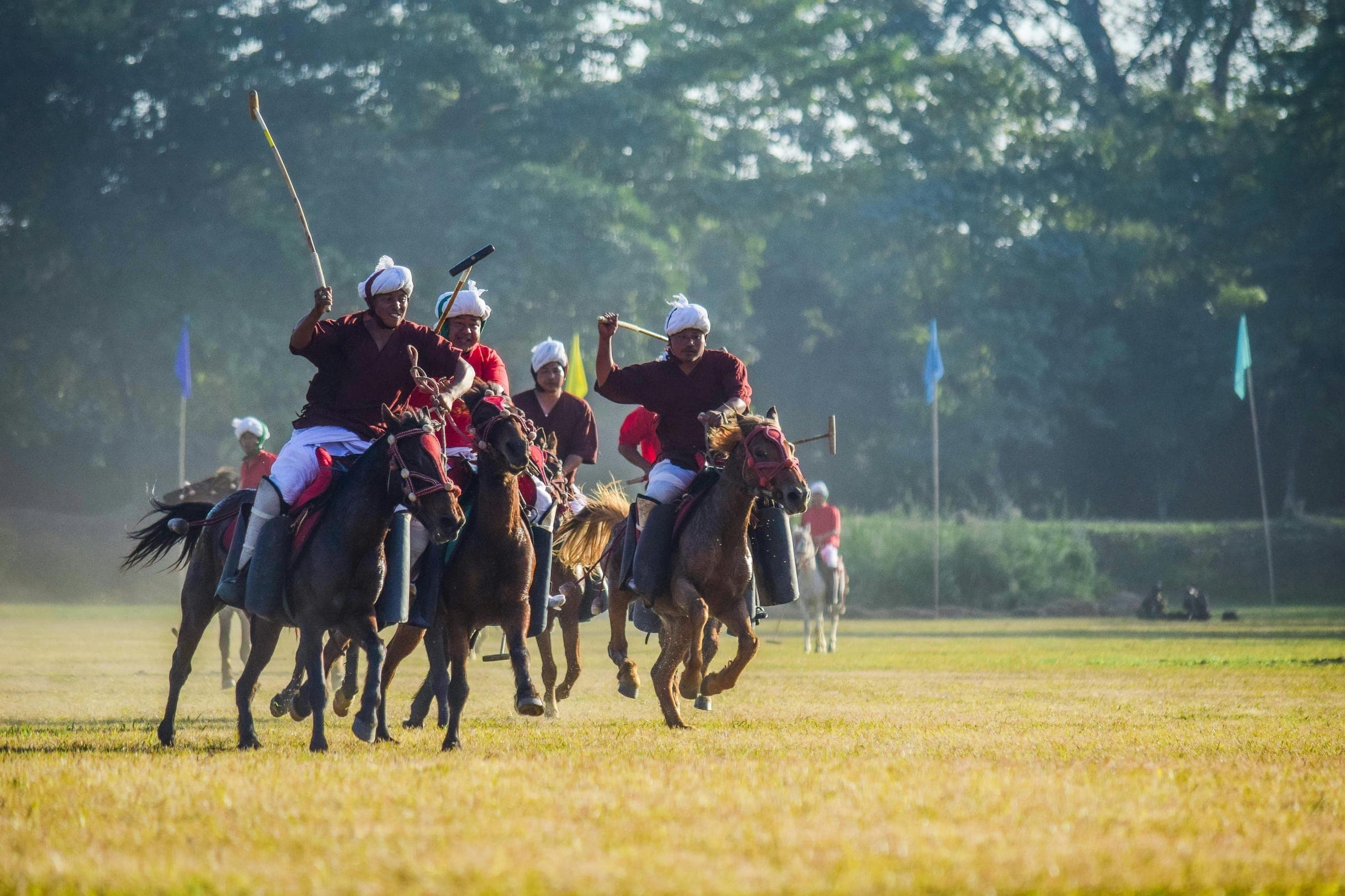 Manipuri ponies and riders on the Imphal polo ground at golden hour